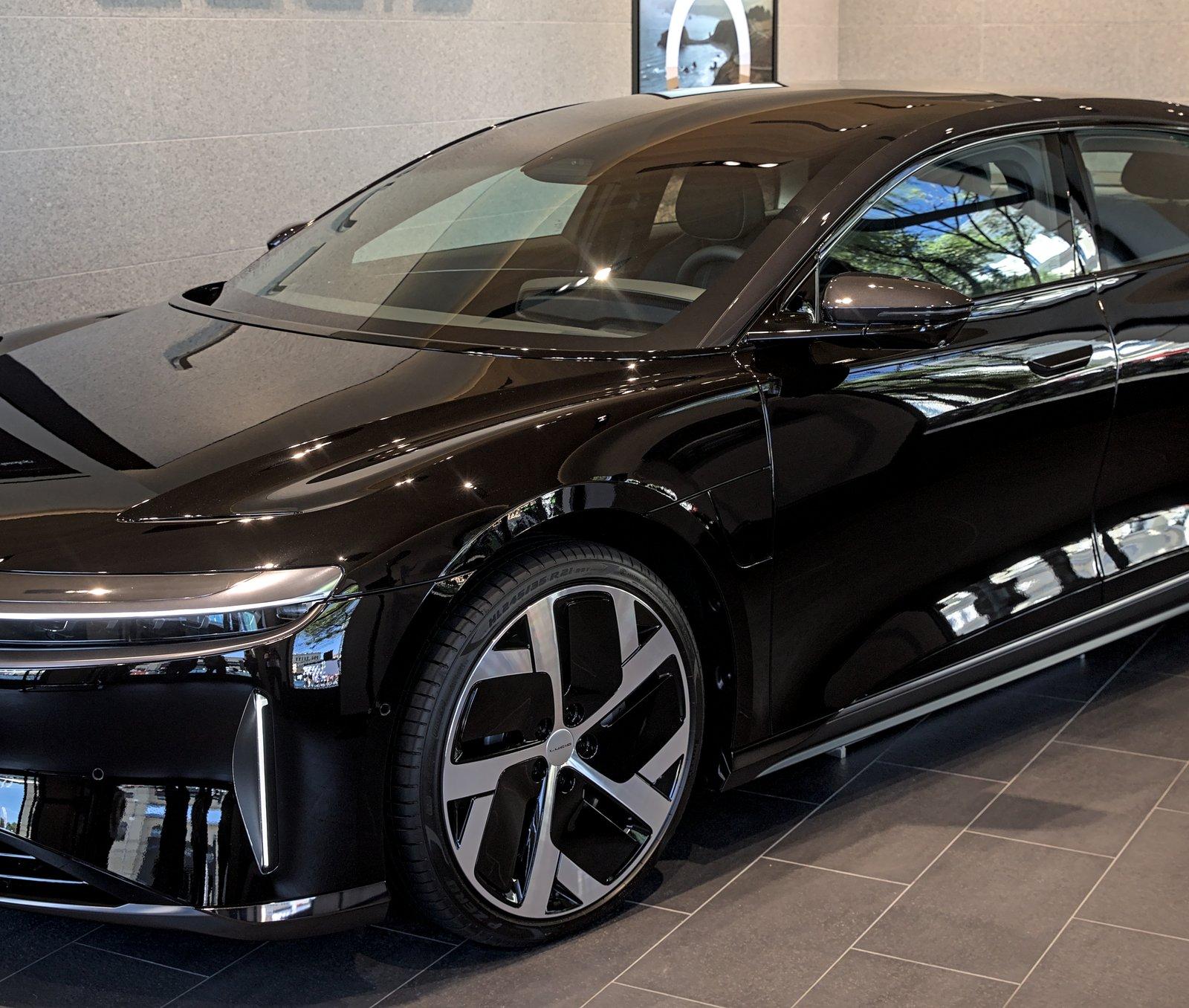 Front three-quarter view of a car on the showroom floor